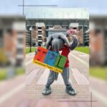 University of Alabama's Big Al holding an oversize Tuscaloosa library card