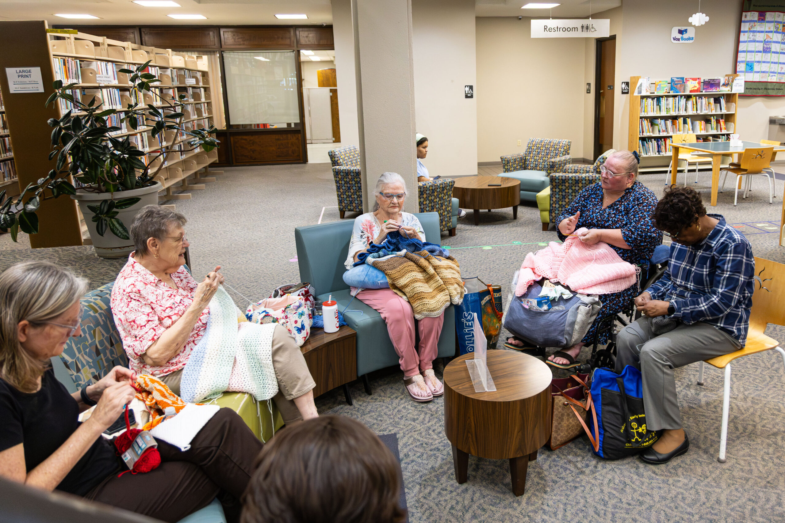 Ladies sitting and crocheting at the library