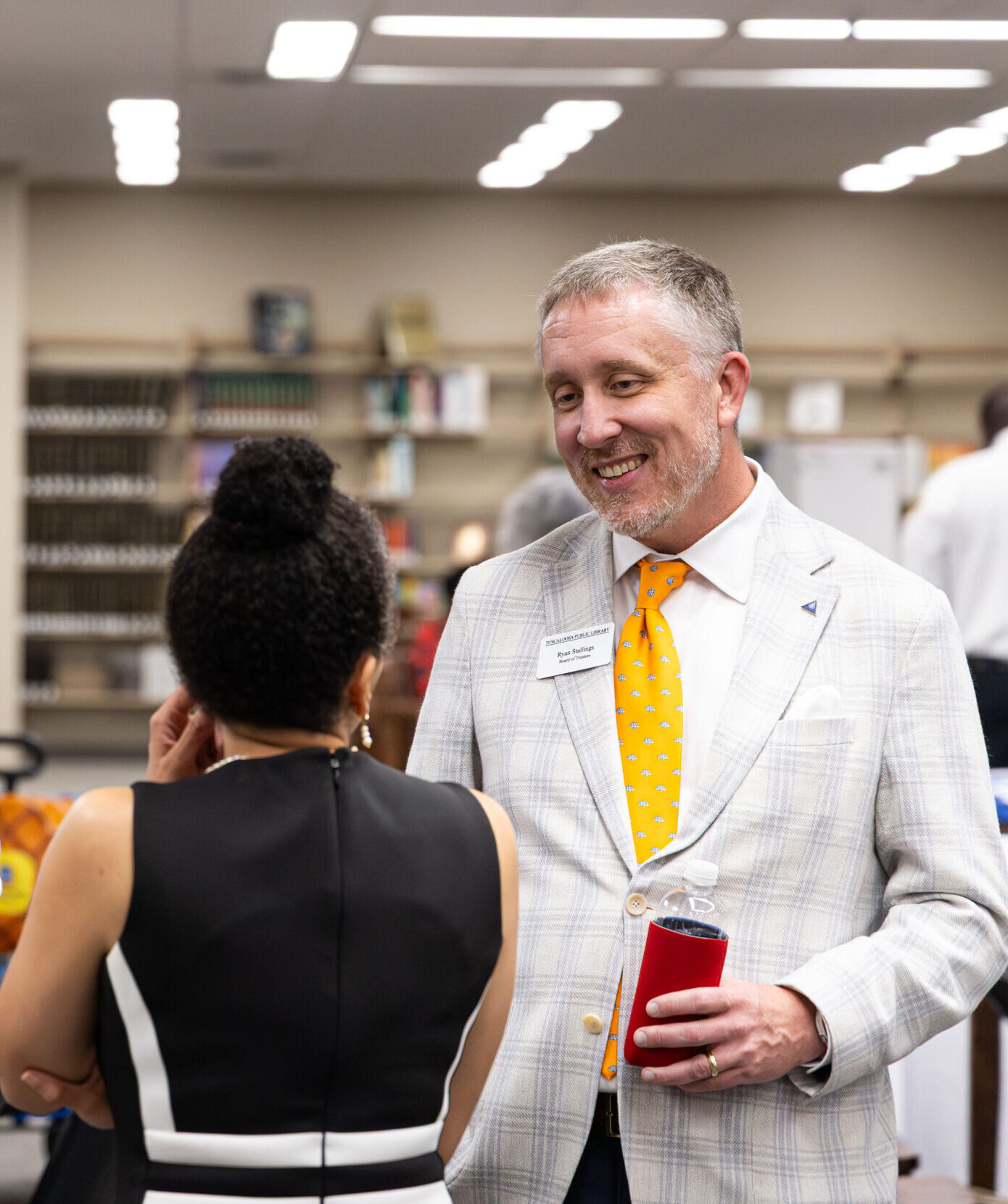 People talking at a library event