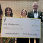 TPL Foundation board members and officers of the Anderson Society holding a check to the Foundation for $25,000
