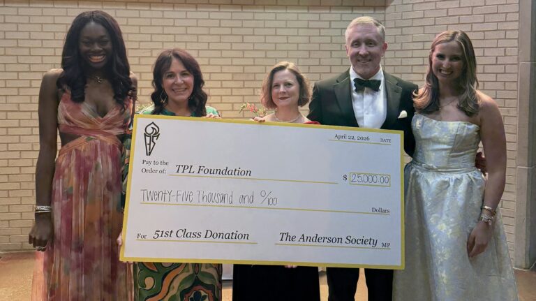 TPL Foundation board members and officers of the Anderson Society holding a check to the Foundation for $25,000
