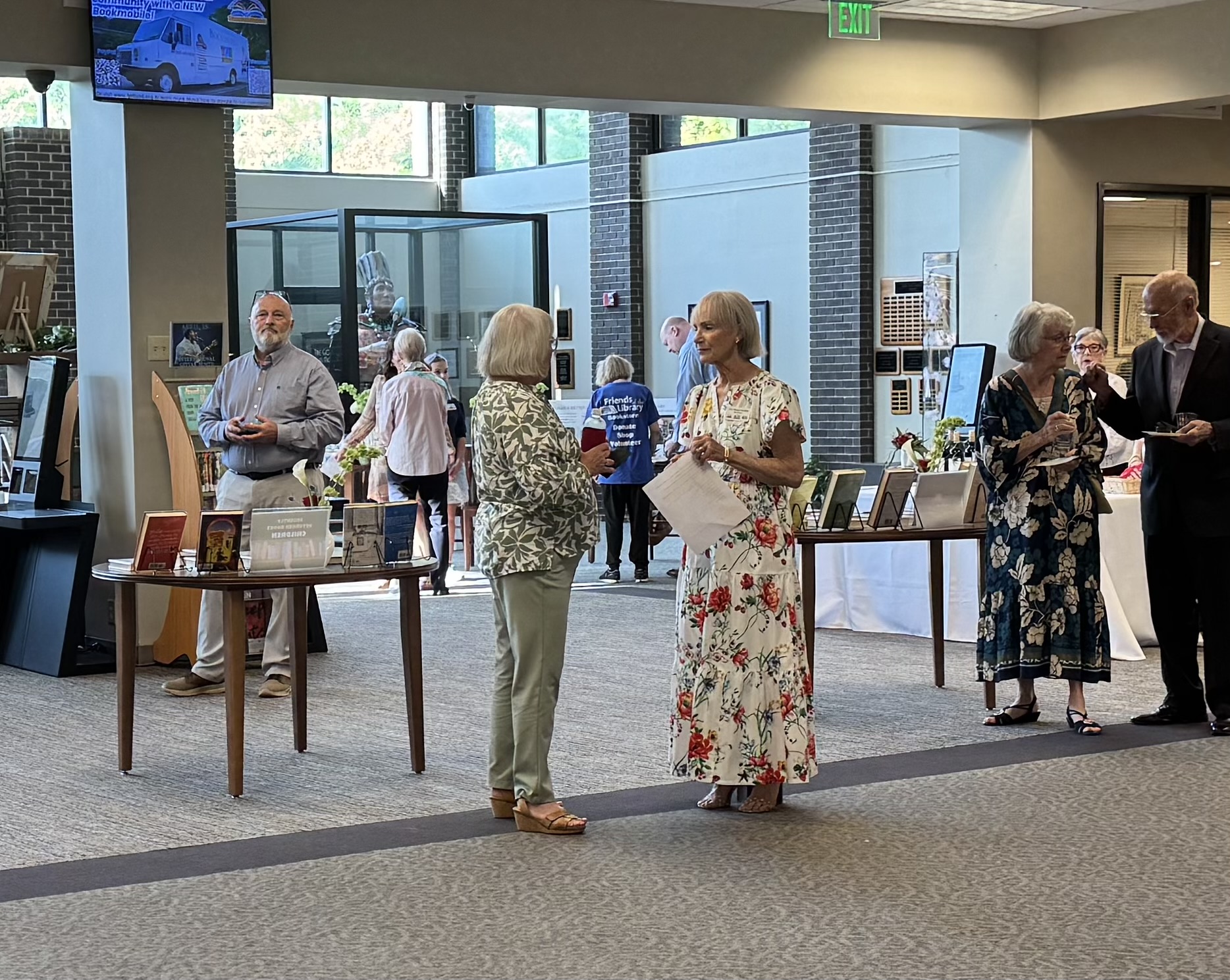 Attendees conversing at the Living Library event.